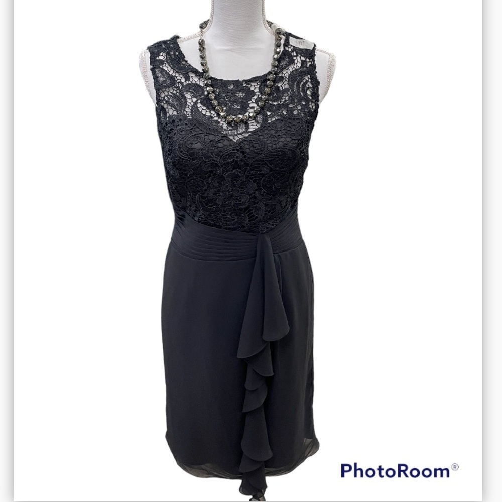 Beautiful black dress size M 100% polyester sheer neckline area zip up back